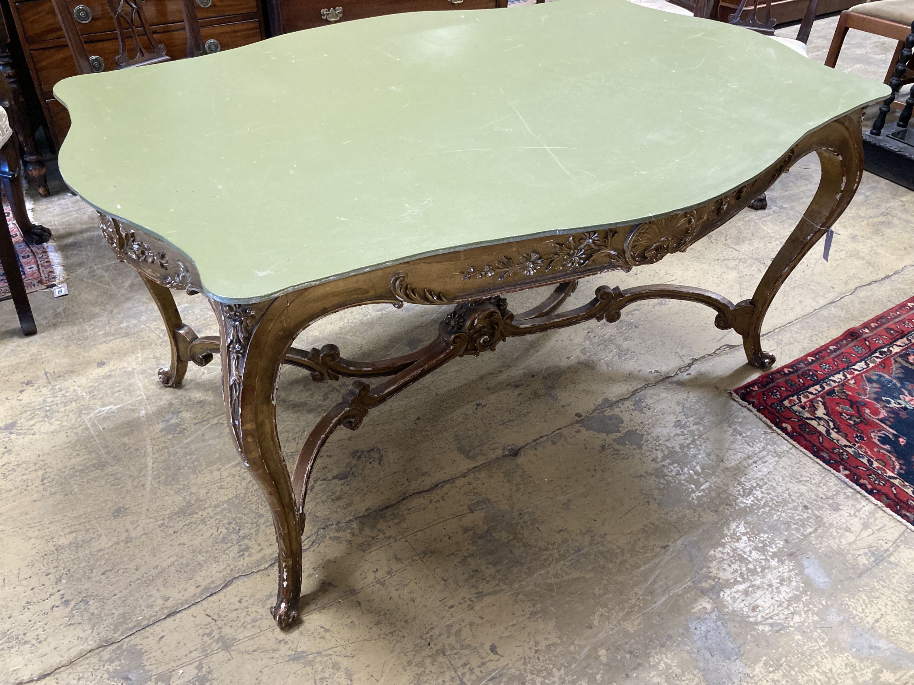 A large 19th century gilt carved wood and plaster cente table (lacking top), width 150cm, depth 85cm, height 72cm